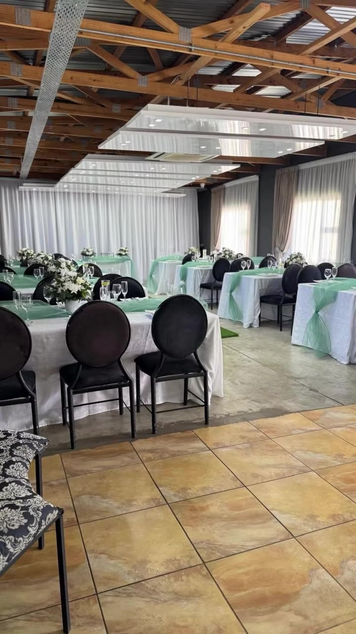 Mint green tables under the timber roof